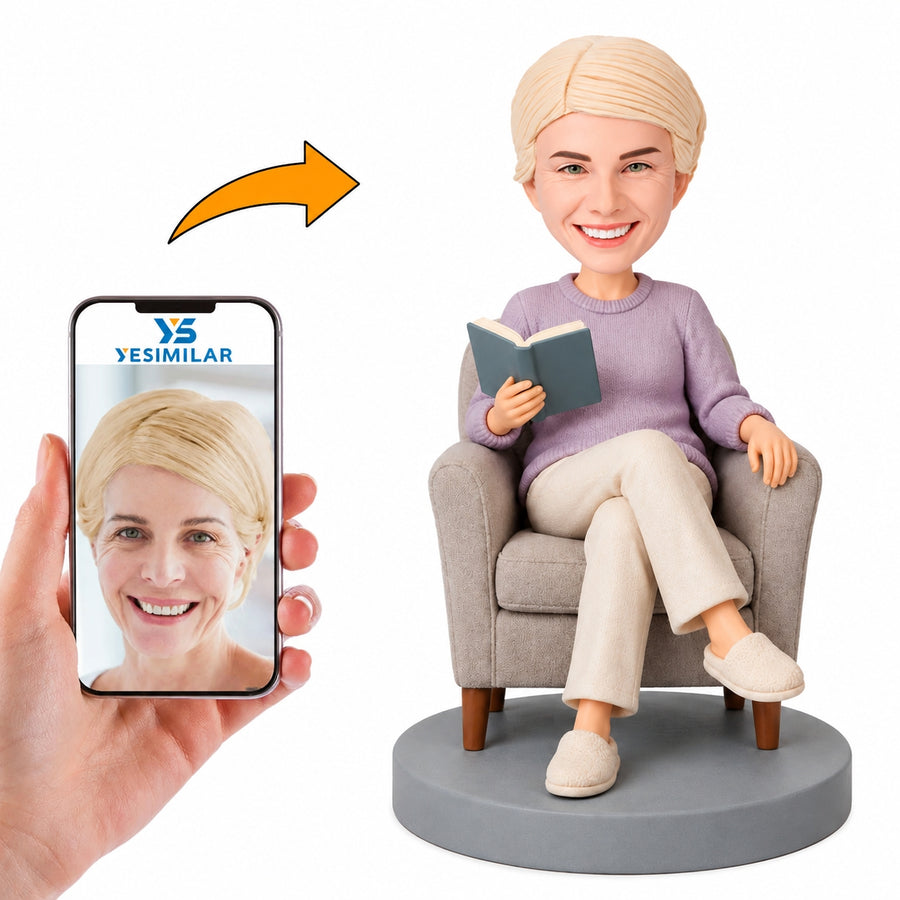 Custom seated woman reading bobblehead made from a reference photo