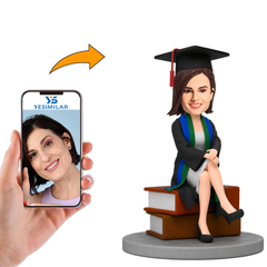 Custom Bobbleheads Female Graduate Sitting on a Book